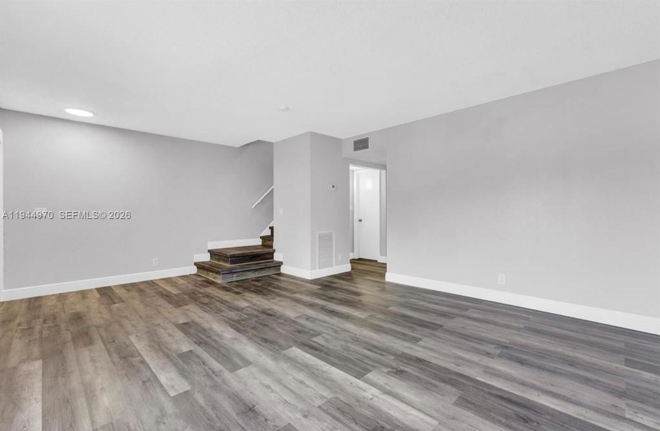 7402 Northwest 75th Street Tamarac, FL 33321 - Photo 33 of 38 a view of a room with wooden floor