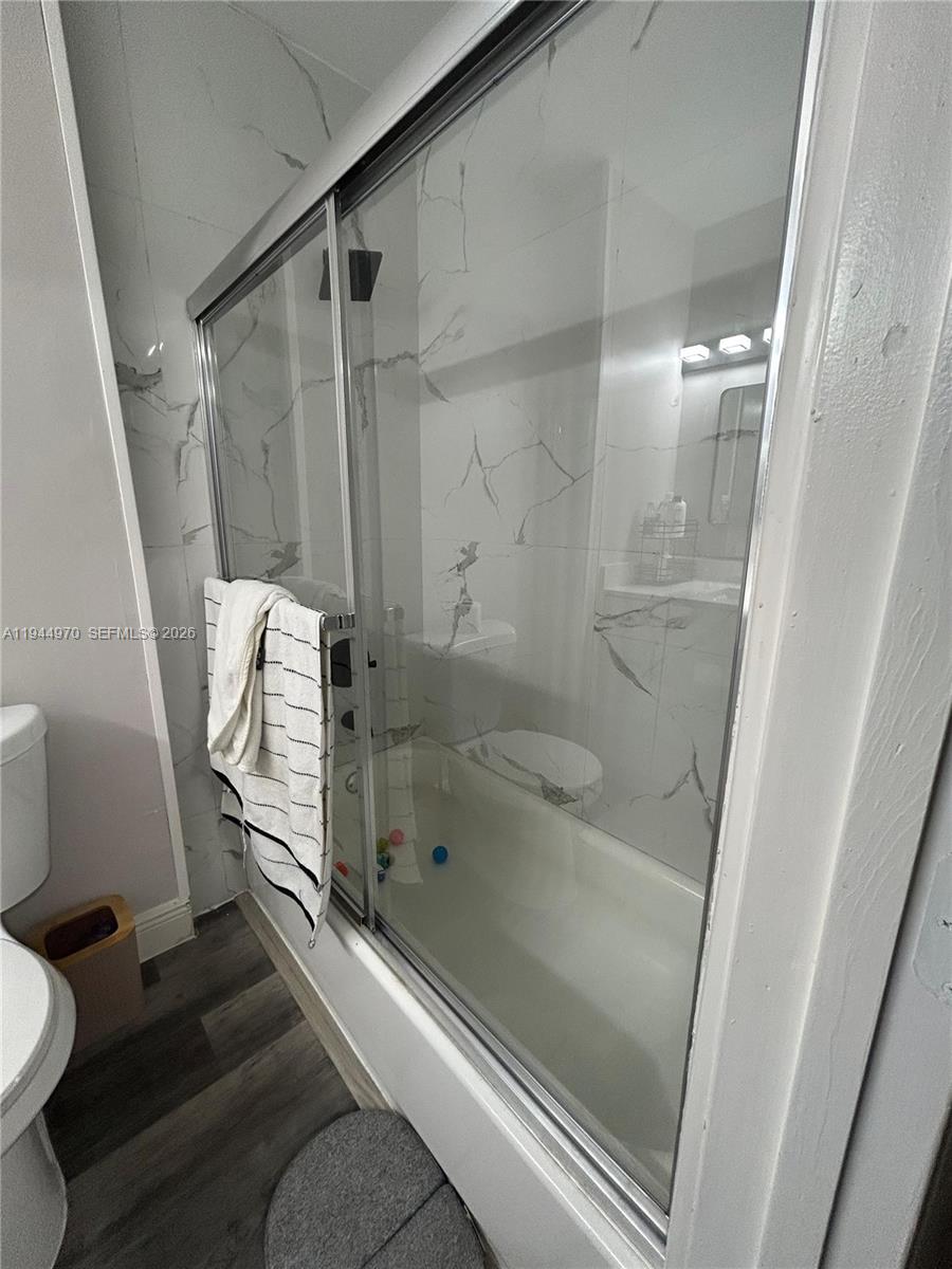 7402 Northwest 75th Street Tamarac, FL 33321 - Photo 4 of 38 a bathroom with a shower and toilet