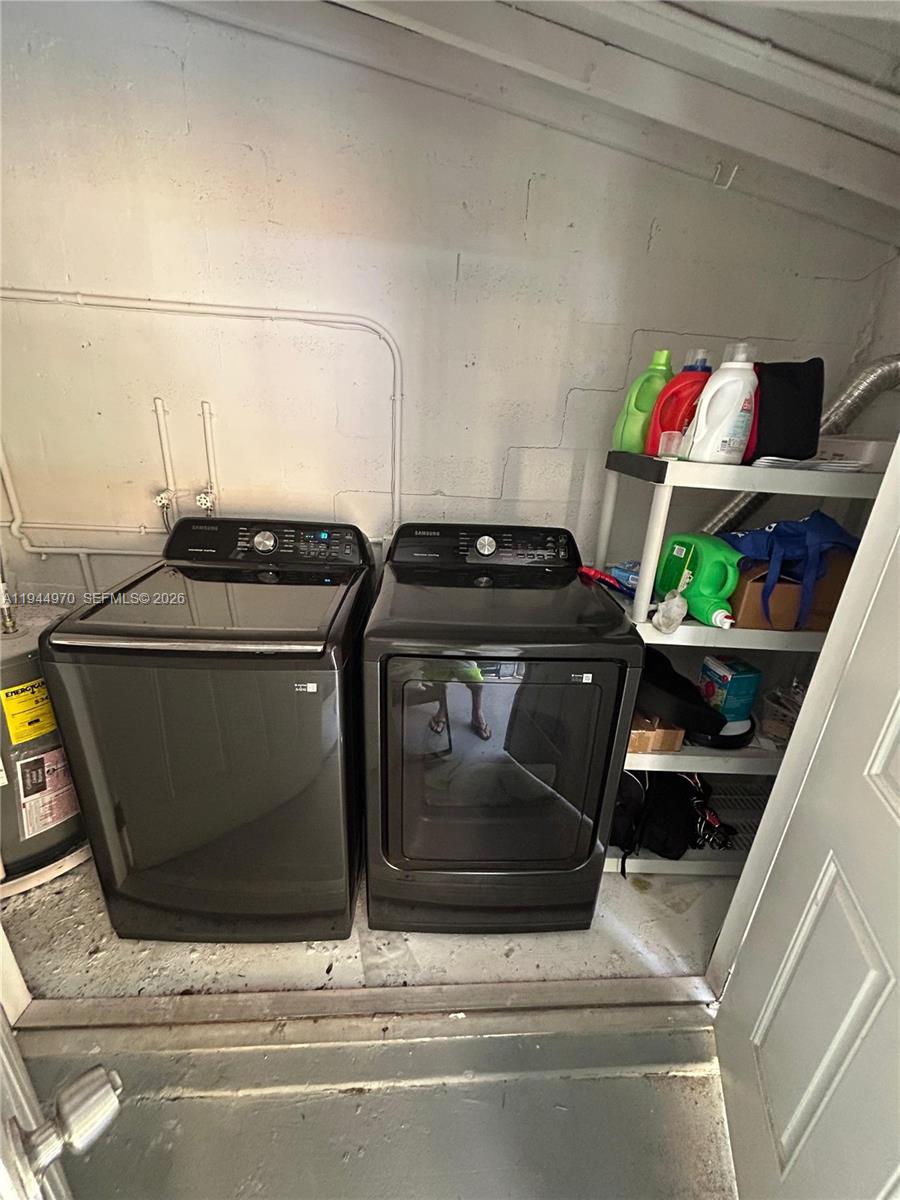 7402 Northwest 75th Street Tamarac, FL 33321 - Photo 7 of 38 a utility room with dryer and washer