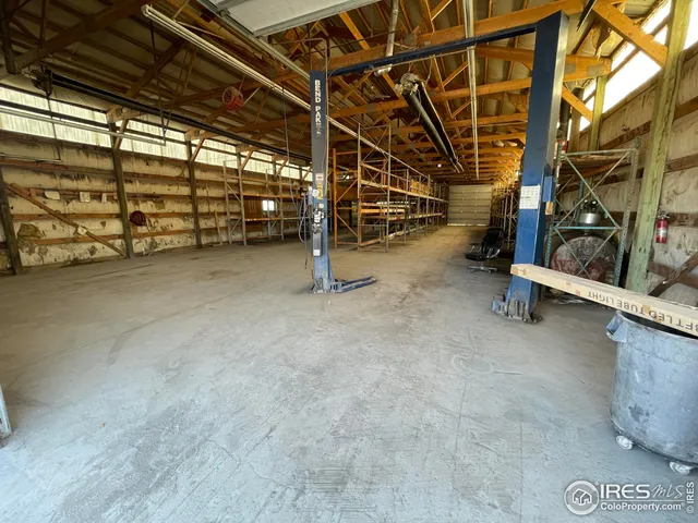 a view of an empty room with gym equipment