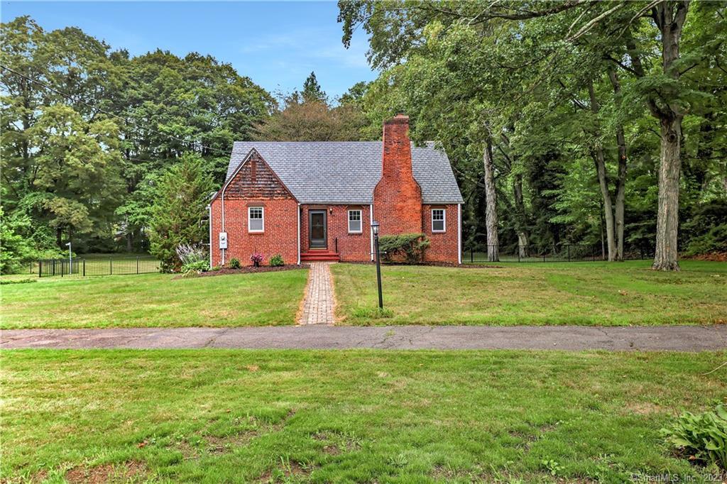 3 Justin Road Woodbridge, CT 06525 - Photo 1 of 1 a view of a house next to a big yard and large trees
