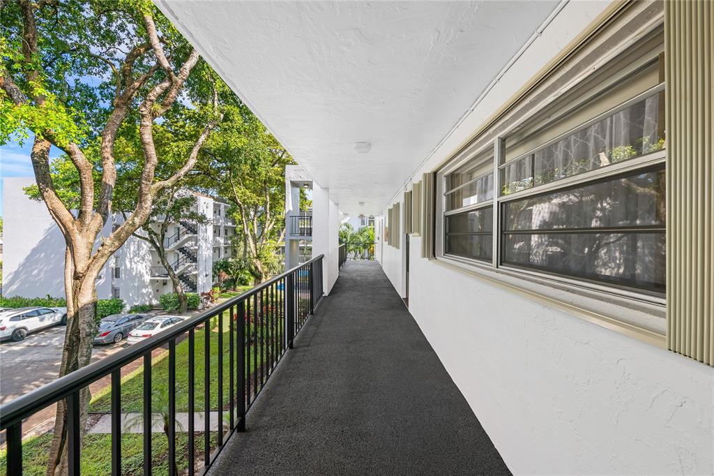 471 North Pine Island Road, Unit 302D Plantation, FL 33324 - Photo 19 of 23 a view of a building from a balcony