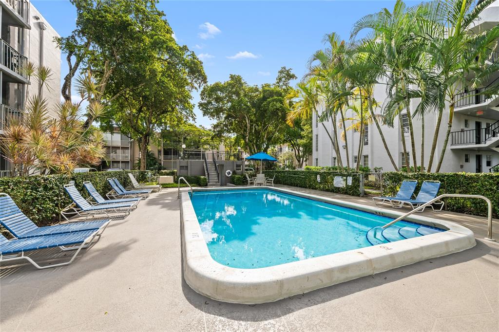 471 North Pine Island Road, Unit 302D Plantation, FL 33324 - Photo 23 of 23 a view of swimming pool with chairs