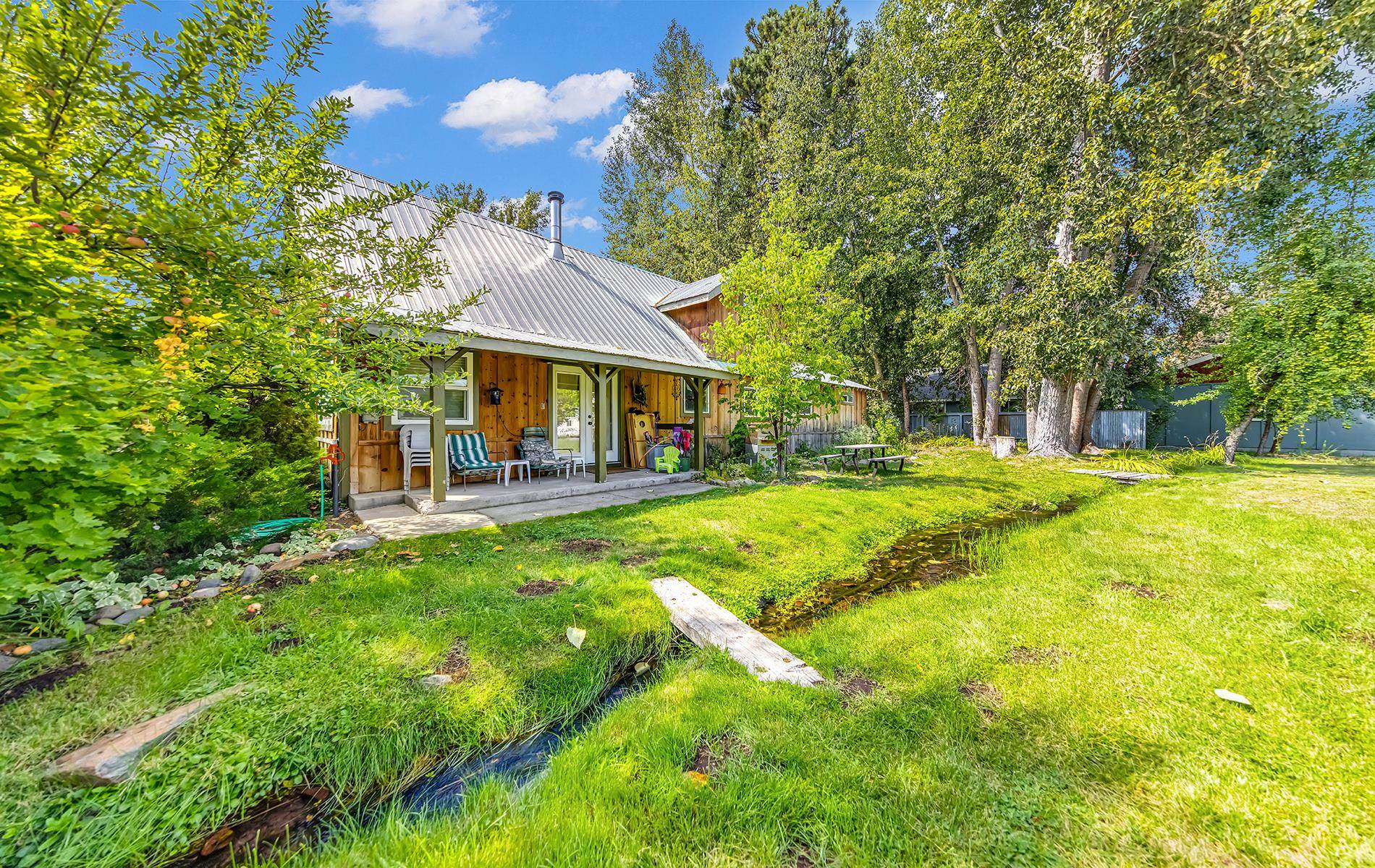 167 Stover Road Chester, CA 96020 - Photo 25 of 33 a view of house with a big yard and large trees