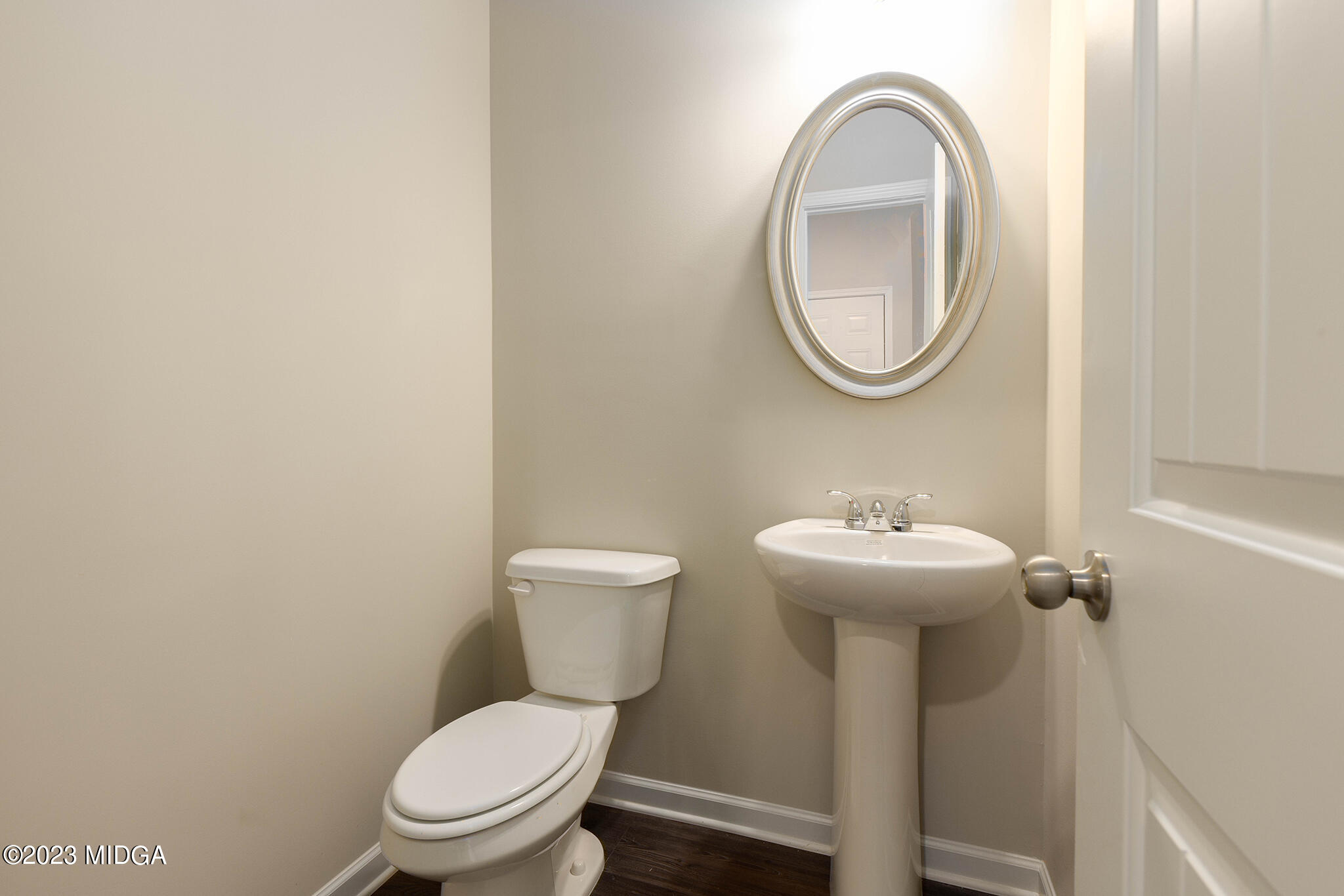 155 Cherokee Rose Drive Jackson, GA 30233 - Photo 15 of 32 a white toilet sitting next to a white sink