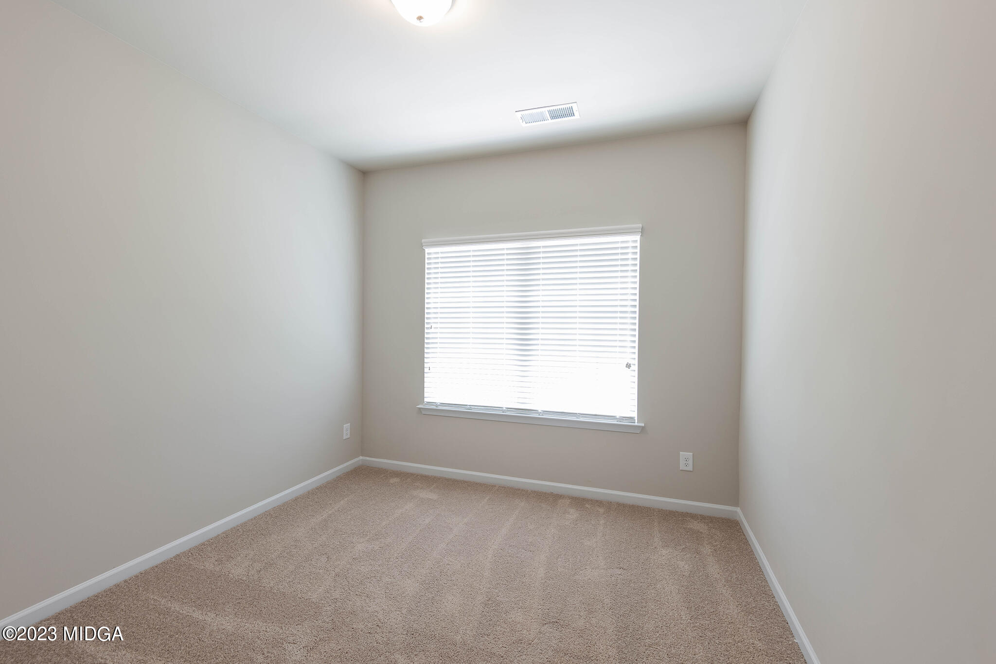 155 Cherokee Rose Drive Jackson, GA 30233 - Photo 16 of 32 an empty room with a window