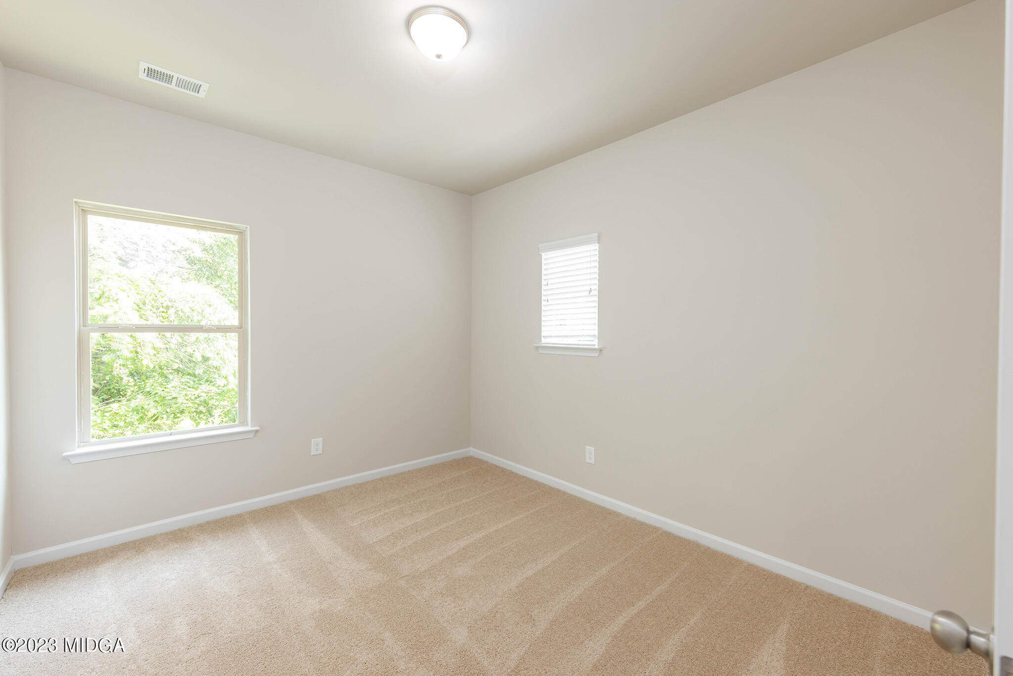 155 Cherokee Rose Drive Jackson, GA 30233 - Photo 18 of 32 an empty room with a window