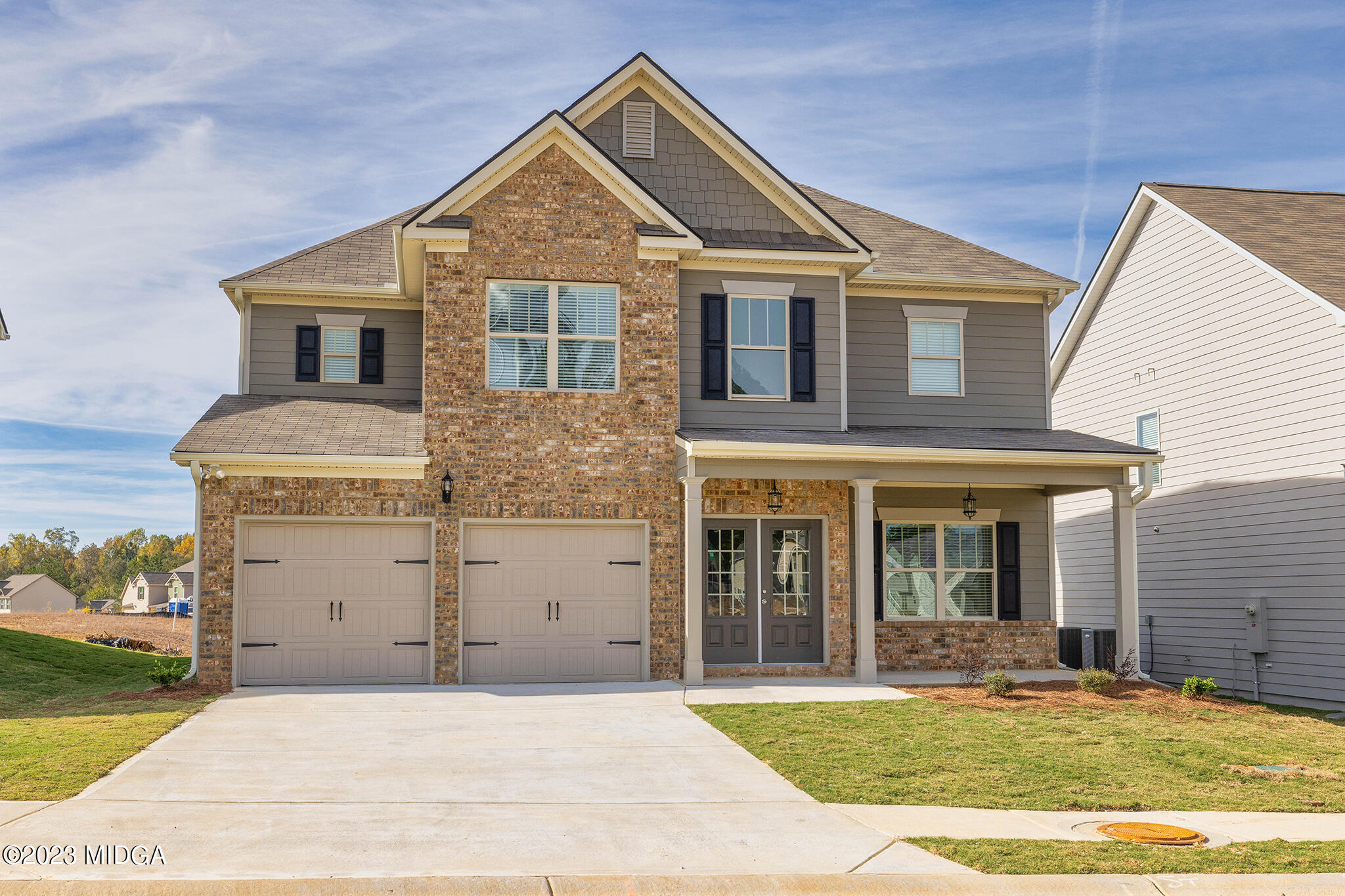 155 Cherokee Rose Drive Jackson, GA 30233 - Photo 2 of 32 front view of a house with a yard