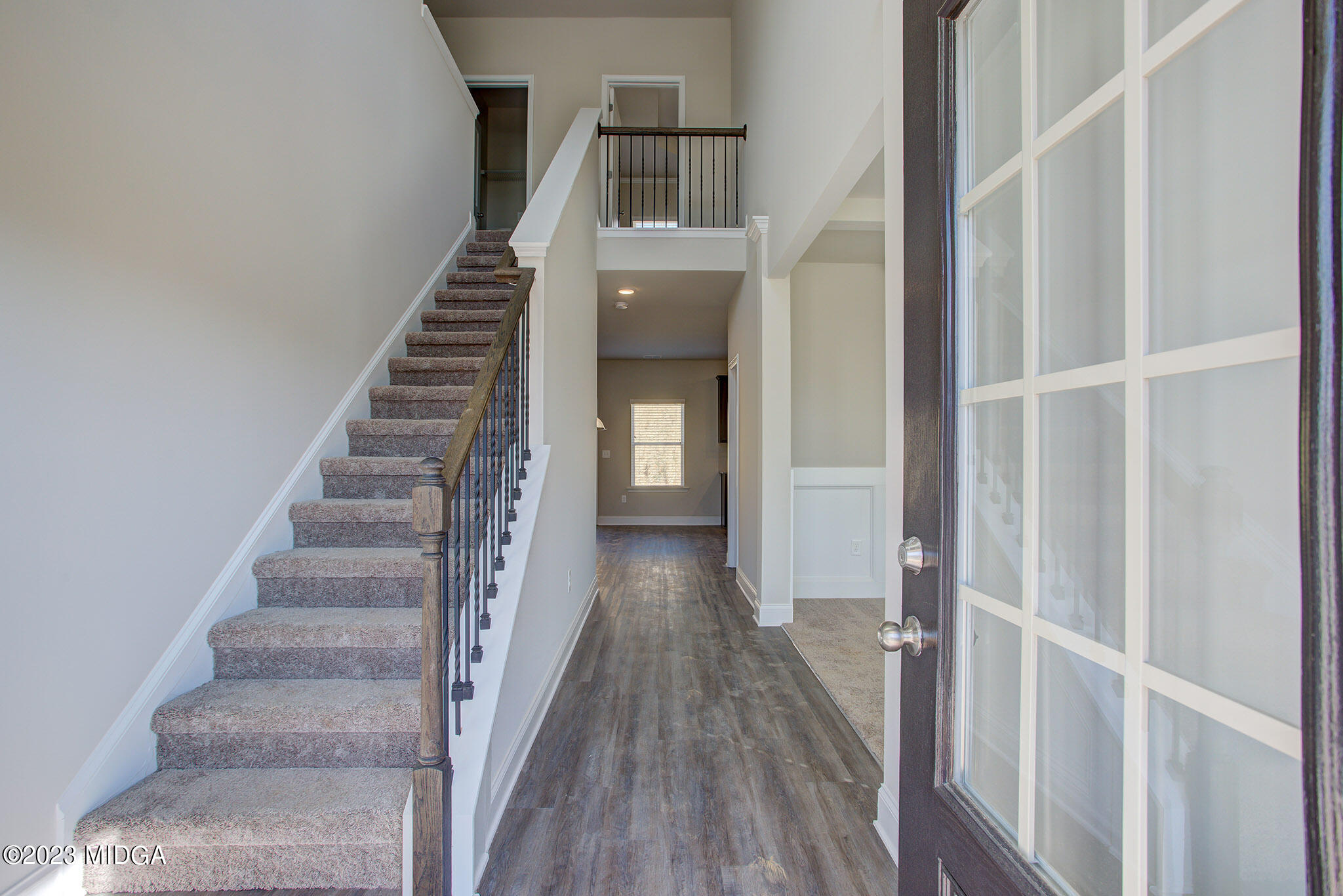 155 Cherokee Rose Drive Jackson, GA 30233 - Photo 6 of 32 a view of a hallway with wooden floor and entryway