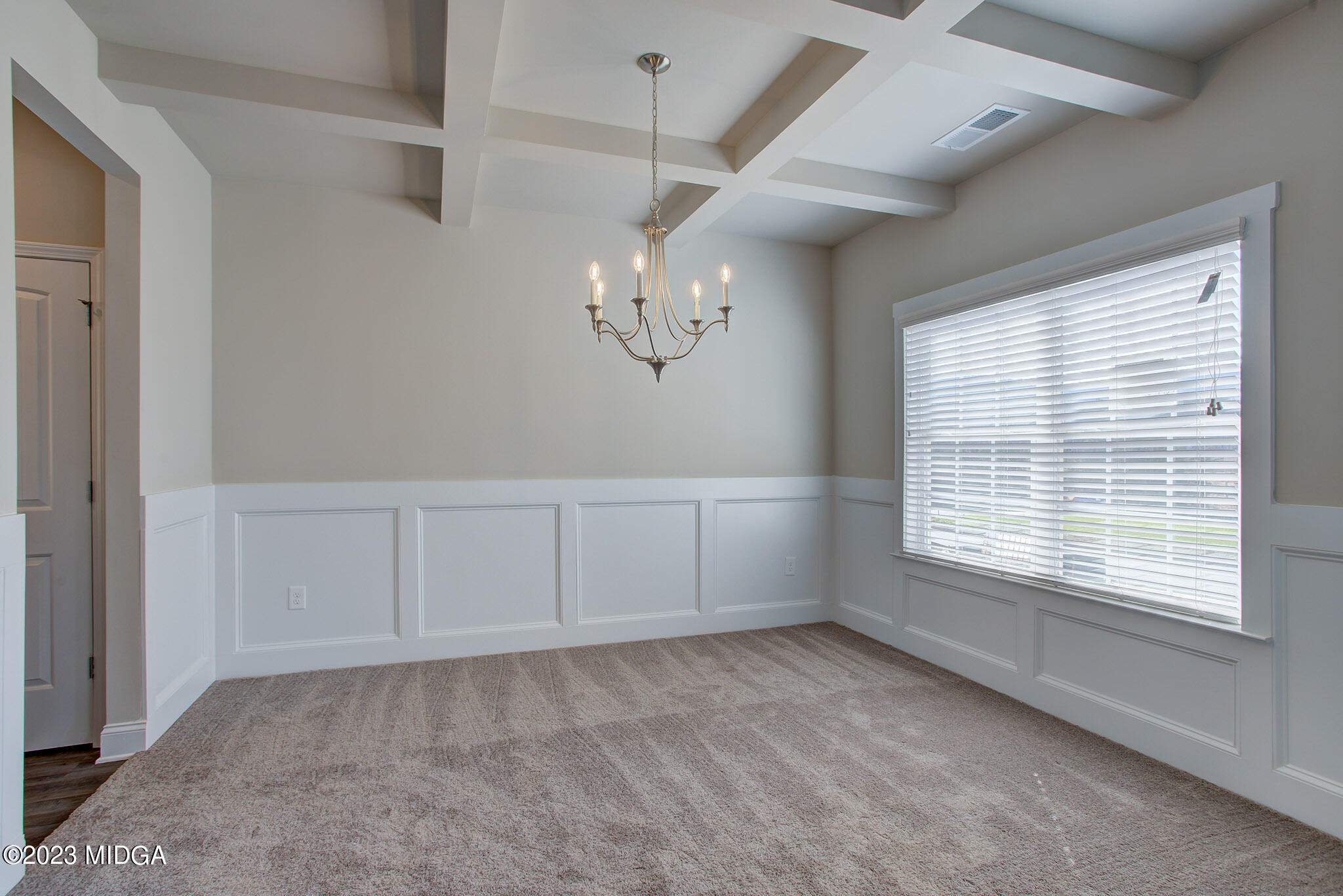155 Cherokee Rose Drive Jackson, GA 30233 - Photo 7 of 32 a view of an empty room with a window