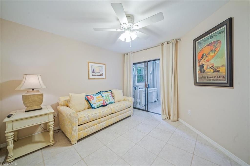 811 Reef Point Circle, Unit 90 Naples, FL 34108 - Photo 16 of 28 a living room with furniture and a window