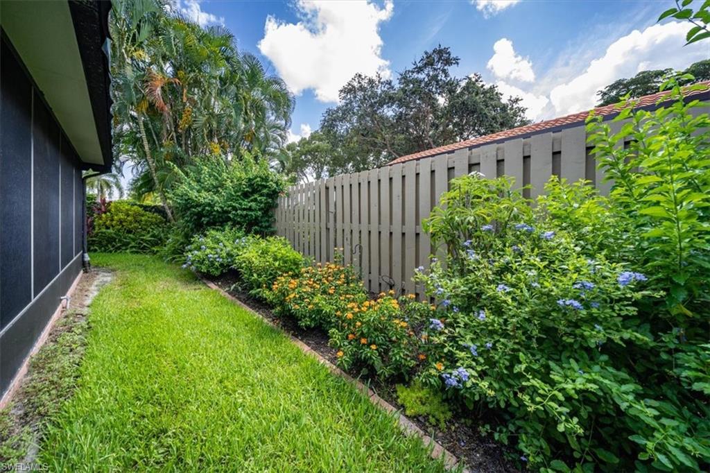 811 Reef Point Circle, Unit 90 Naples, FL 34108 - Photo 26 of 28 a view of a garden with statue