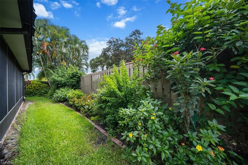 811 Reef Point Circle, Unit 90 Naples, FL 34108 - Photo 27 of 28 a view of a garden with plants
