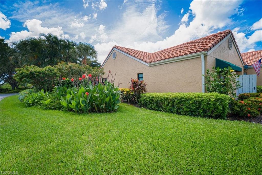 811 Reef Point Circle, Unit 90 Naples, FL 34108 - Photo 5 of 28 a view of a house with a garden