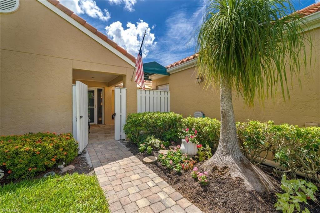 811 Reef Point Circle, Unit 90 Naples, FL 34108 - Photo 7 of 28 a view of a house with a yard