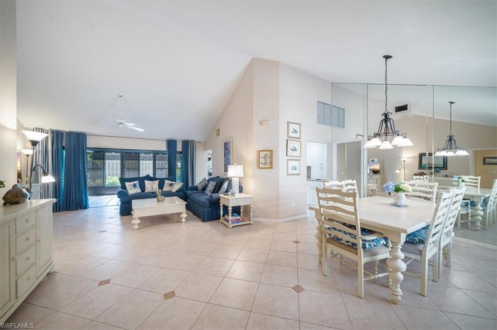 811 Reef Point Circle, Unit 90 Naples, FL 34108 - Photo 10 of 28 a large kitchen with a table and chairs