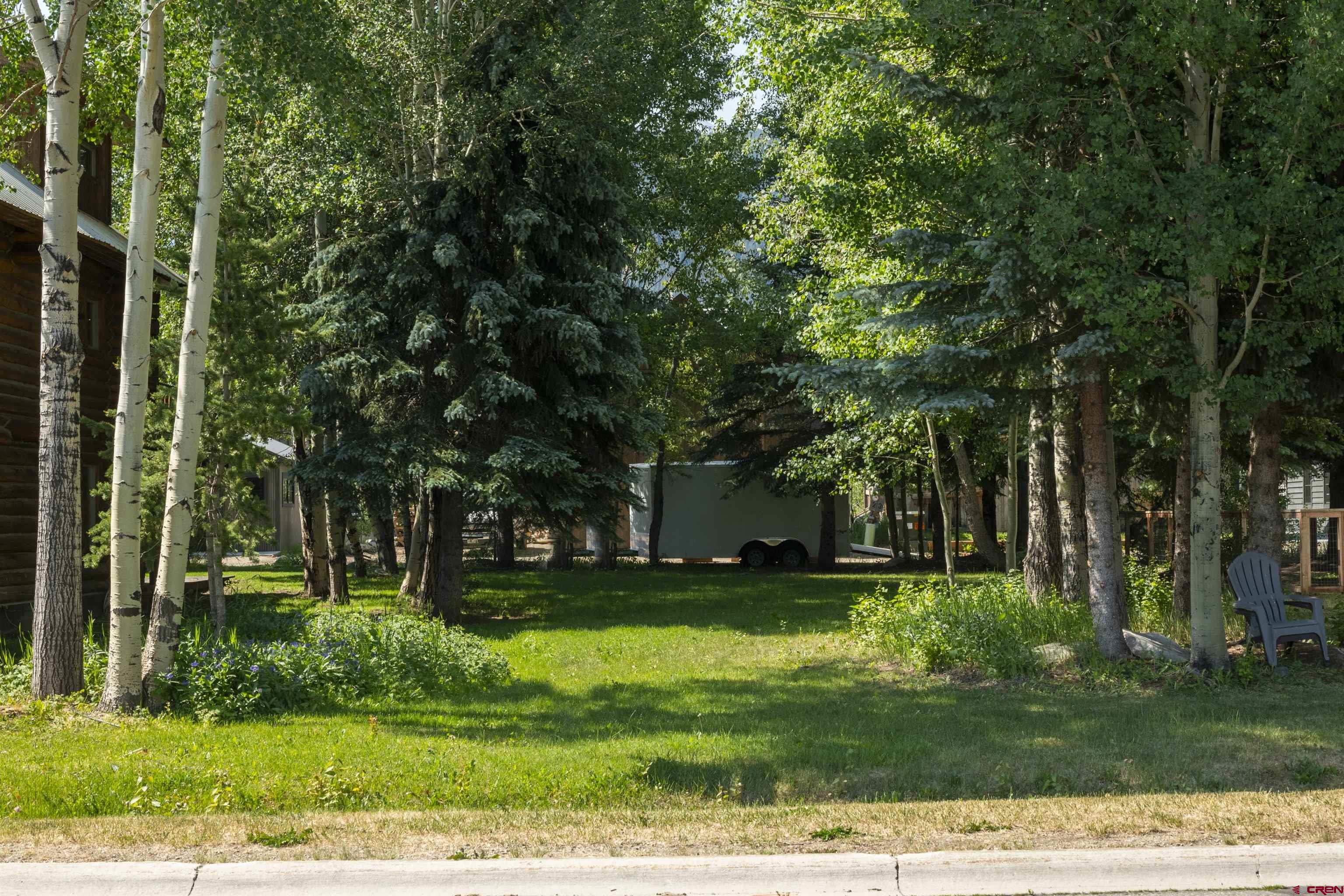 Tbd Butte Avenue Crested Butte, CO 81224 - Photo 30 of 30 a view of a backyard with large trees