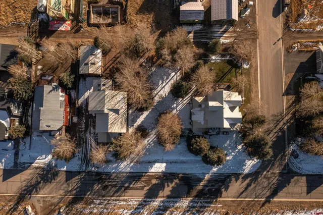 an aerial view of residential houses with outdoor space