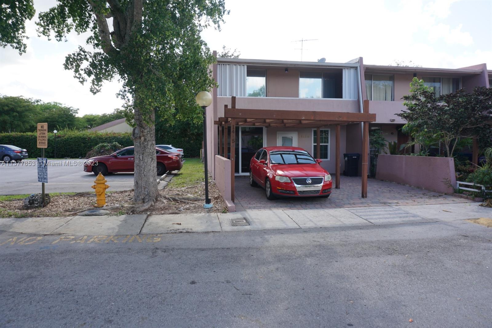 a car parked in front of a house