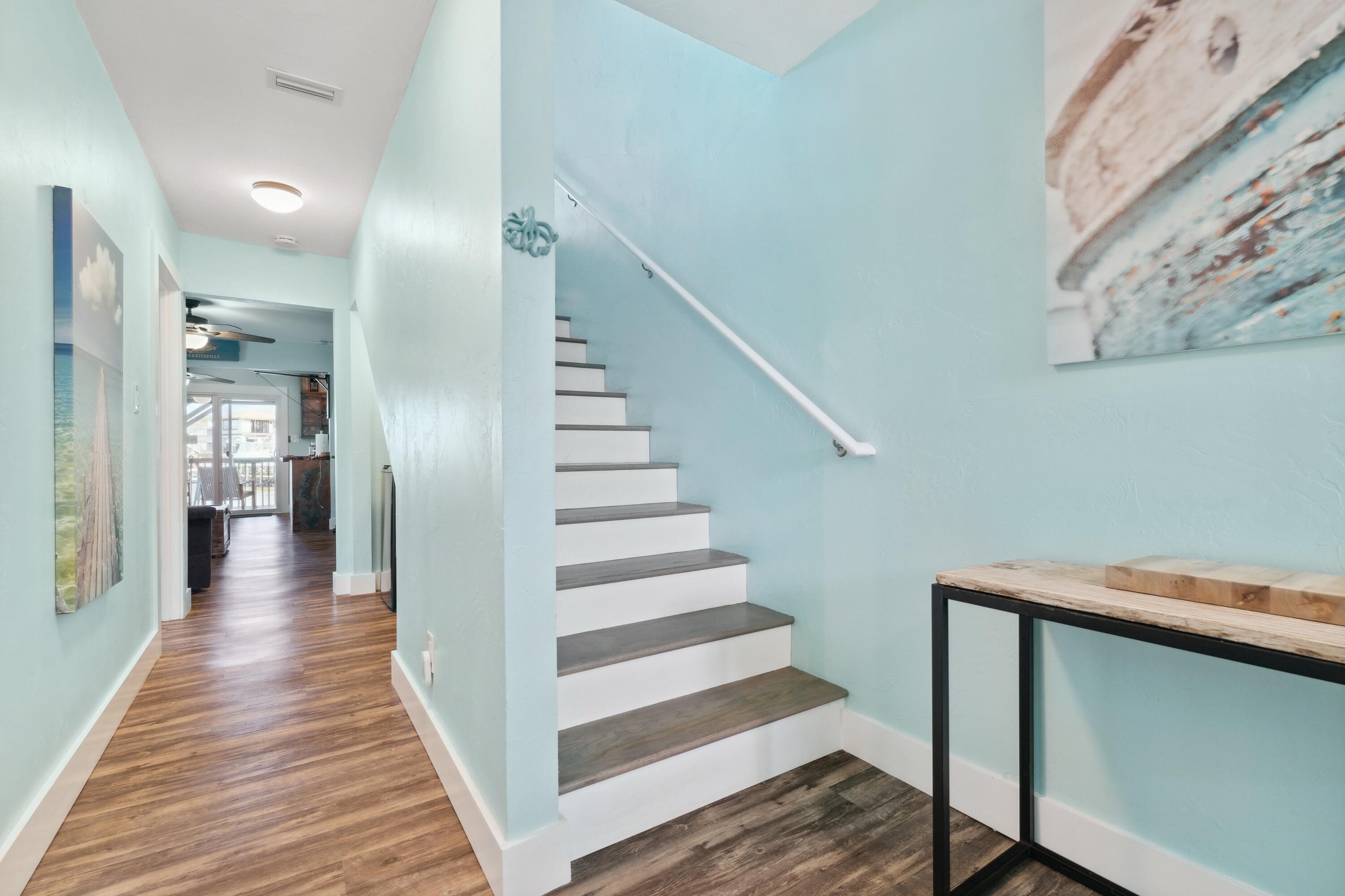 129 Durango Road, Unit 1 Destin, FL 32541 - Photo 34 of 71 a view of a hallway with wooden floor and entryway