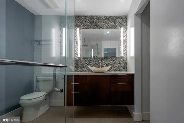 a bathroom with a sink and mirror