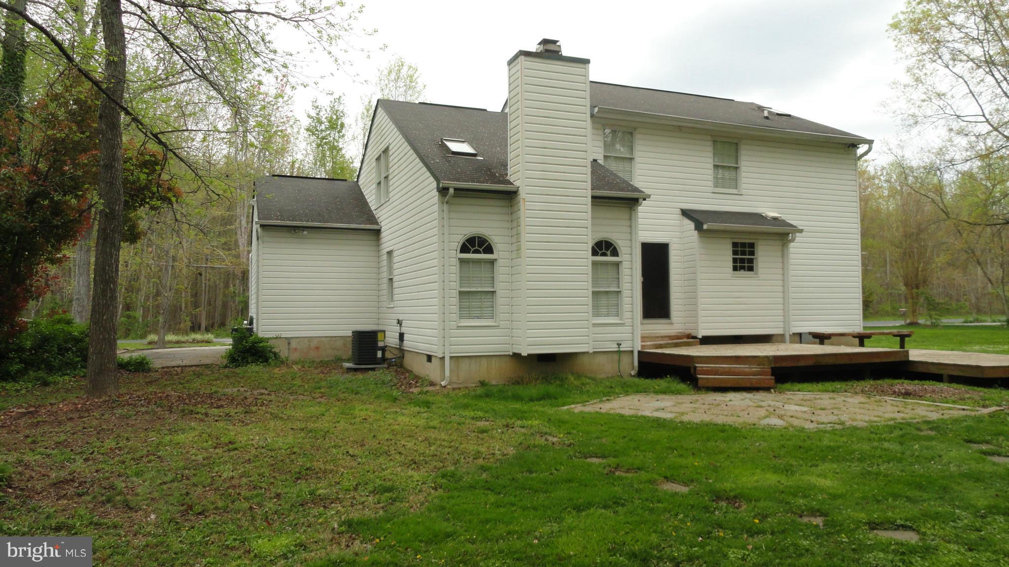 1021 Rodgers Road Churchton, MD 20733 - Photo 2 of 29 a front view of a house with a garden