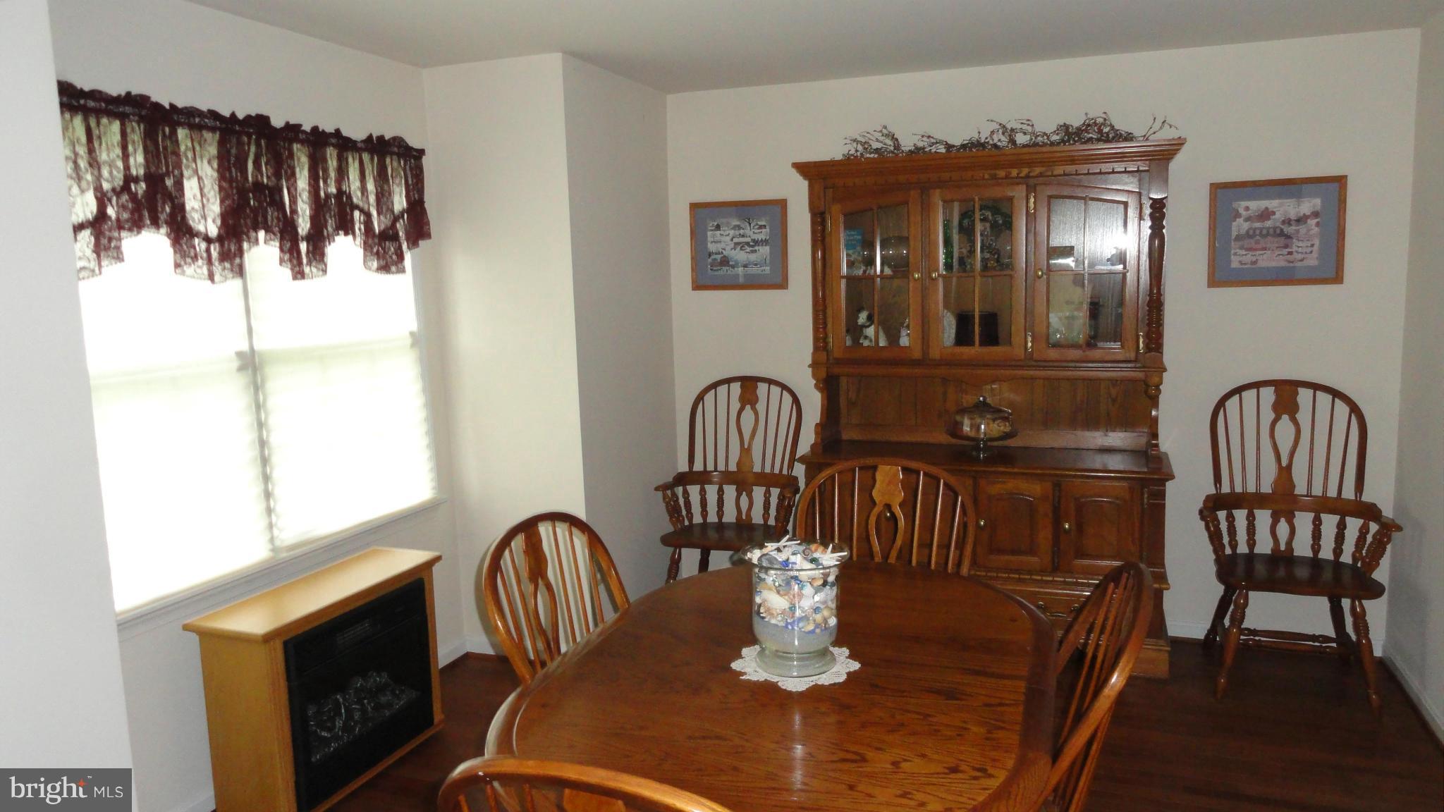 1021 Rodgers Road Churchton, MD 20733 - Photo 11 of 29 a view of a dining room with furniture and chandelier