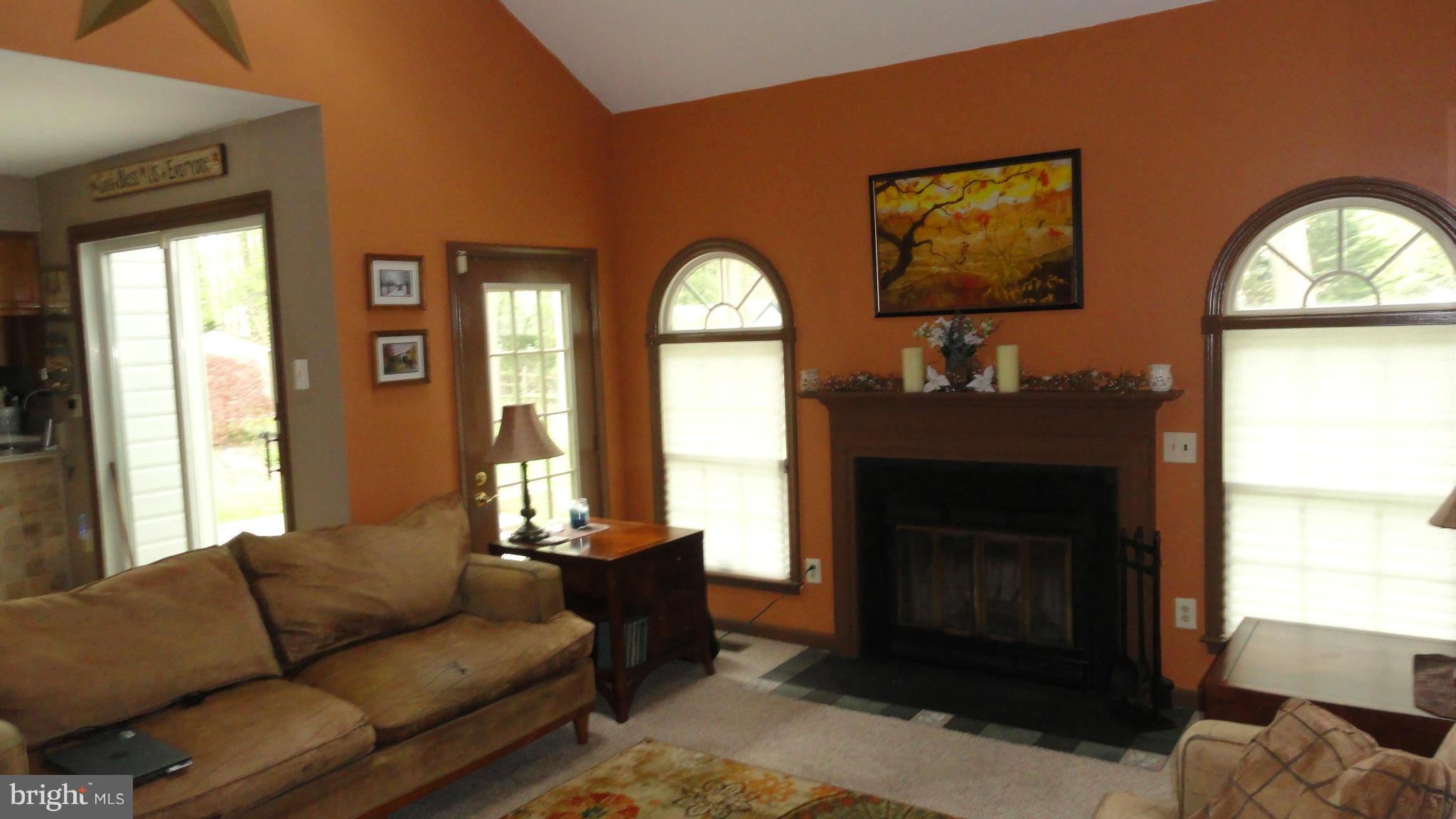 1021 Rodgers Road Churchton, MD 20733 - Photo 15 of 29 a living room with furniture a window and a fireplace