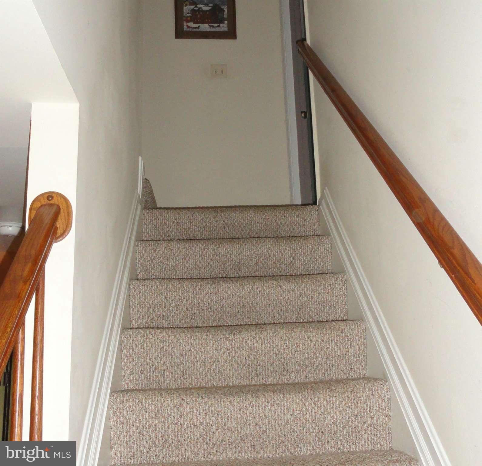 1021 Rodgers Road Churchton, MD 20733 - Photo 16 of 29 a view of staircase with white walls and a window