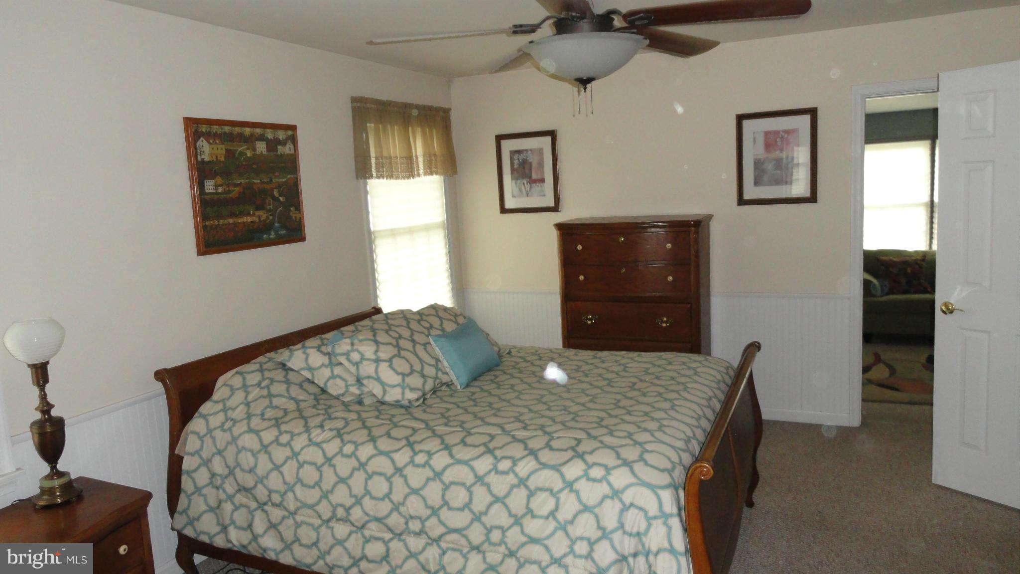 1021 Rodgers Road Churchton, MD 20733 - Photo 20 of 29 a bedroom with a bed and a dresser