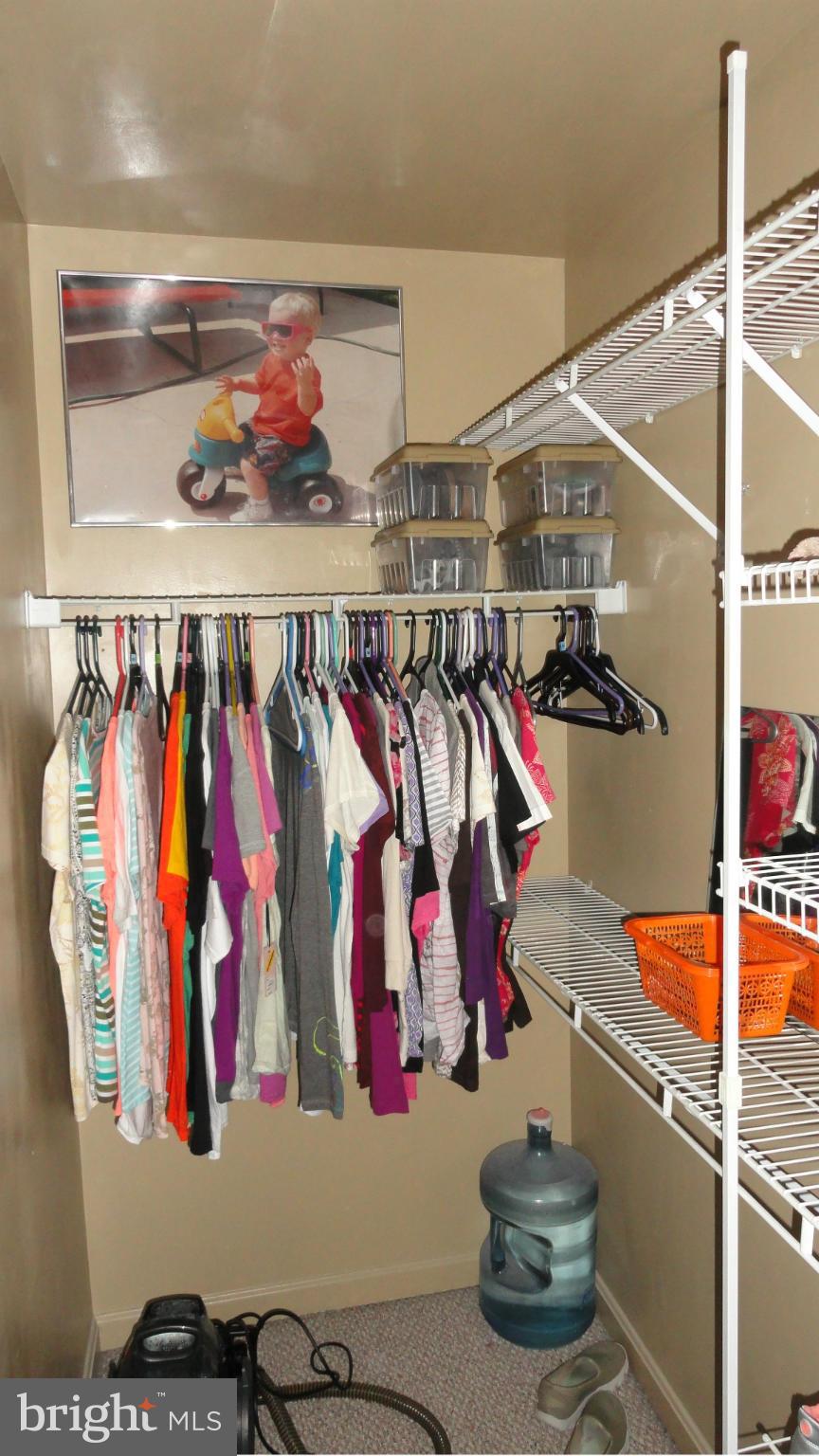 1021 Rodgers Road Churchton, MD 20733 - Photo 23 of 29 a view of walk in closet with clothes and shoes