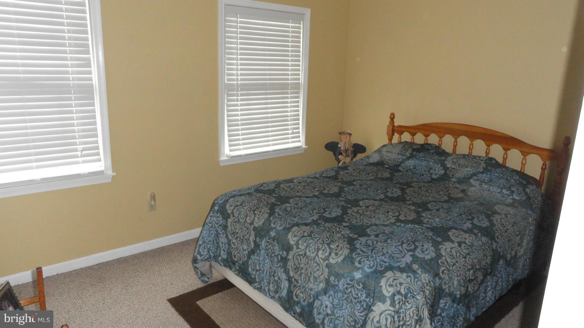 1021 Rodgers Road Churchton, MD 20733 - Photo 25 of 29 a bed sitting in a bedroom next to a window