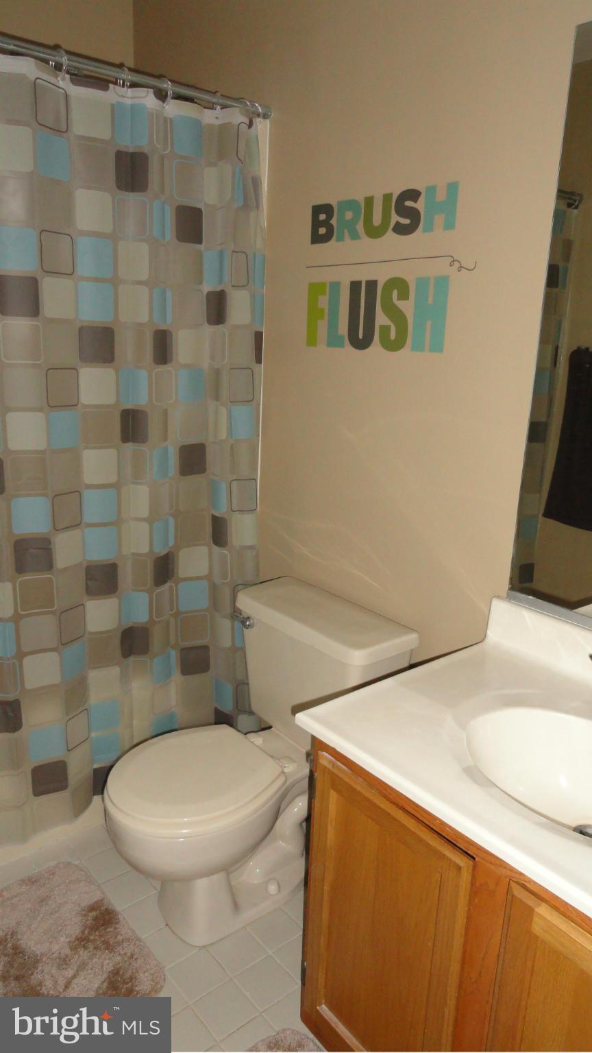 1021 Rodgers Road Churchton, MD 20733 - Photo 26 of 29 a white toilet sitting next to a bathroom sink