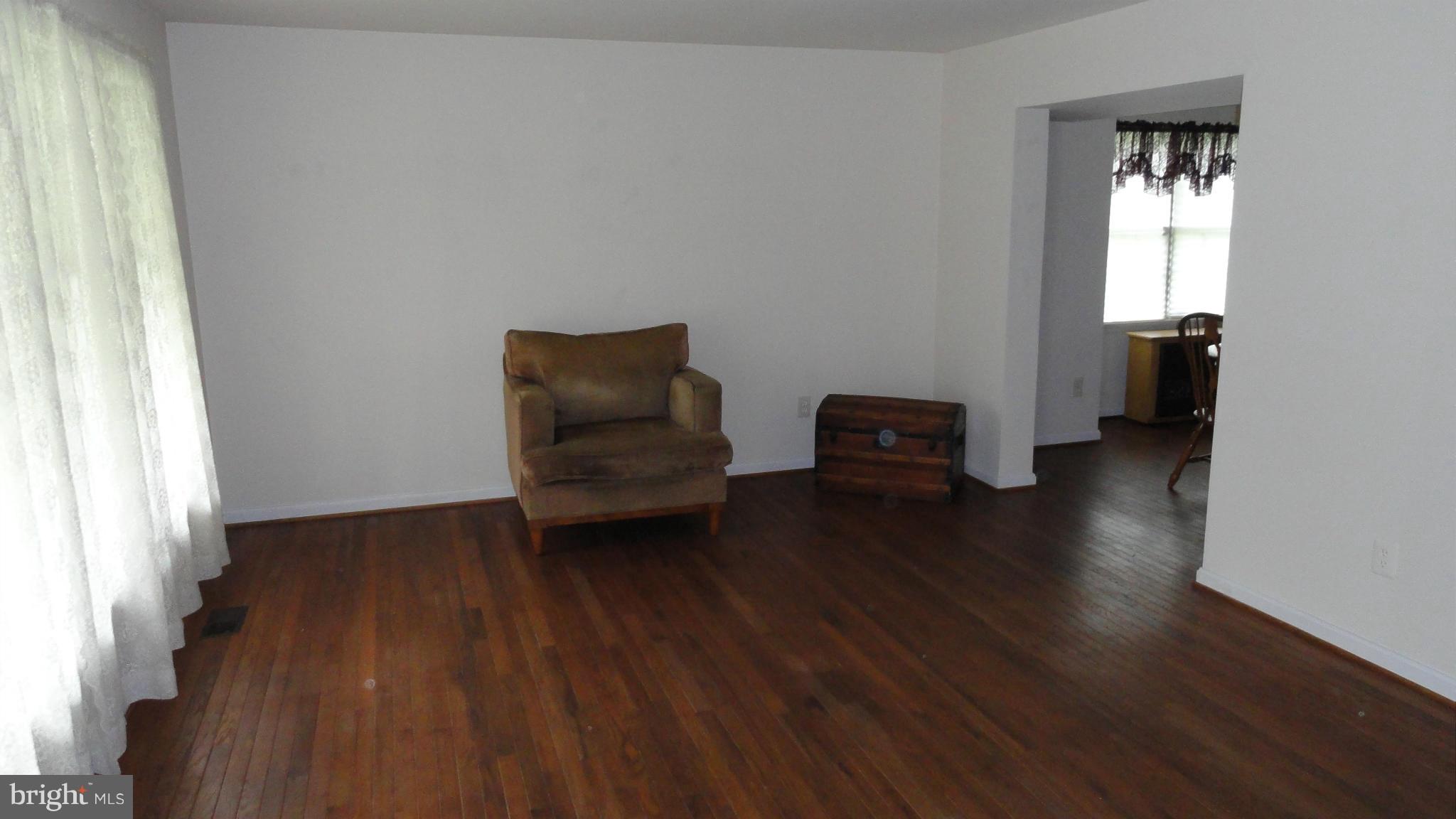 1021 Rodgers Road Churchton, MD 20733 - Photo 6 of 29 a living room with furniture and a wooden floor