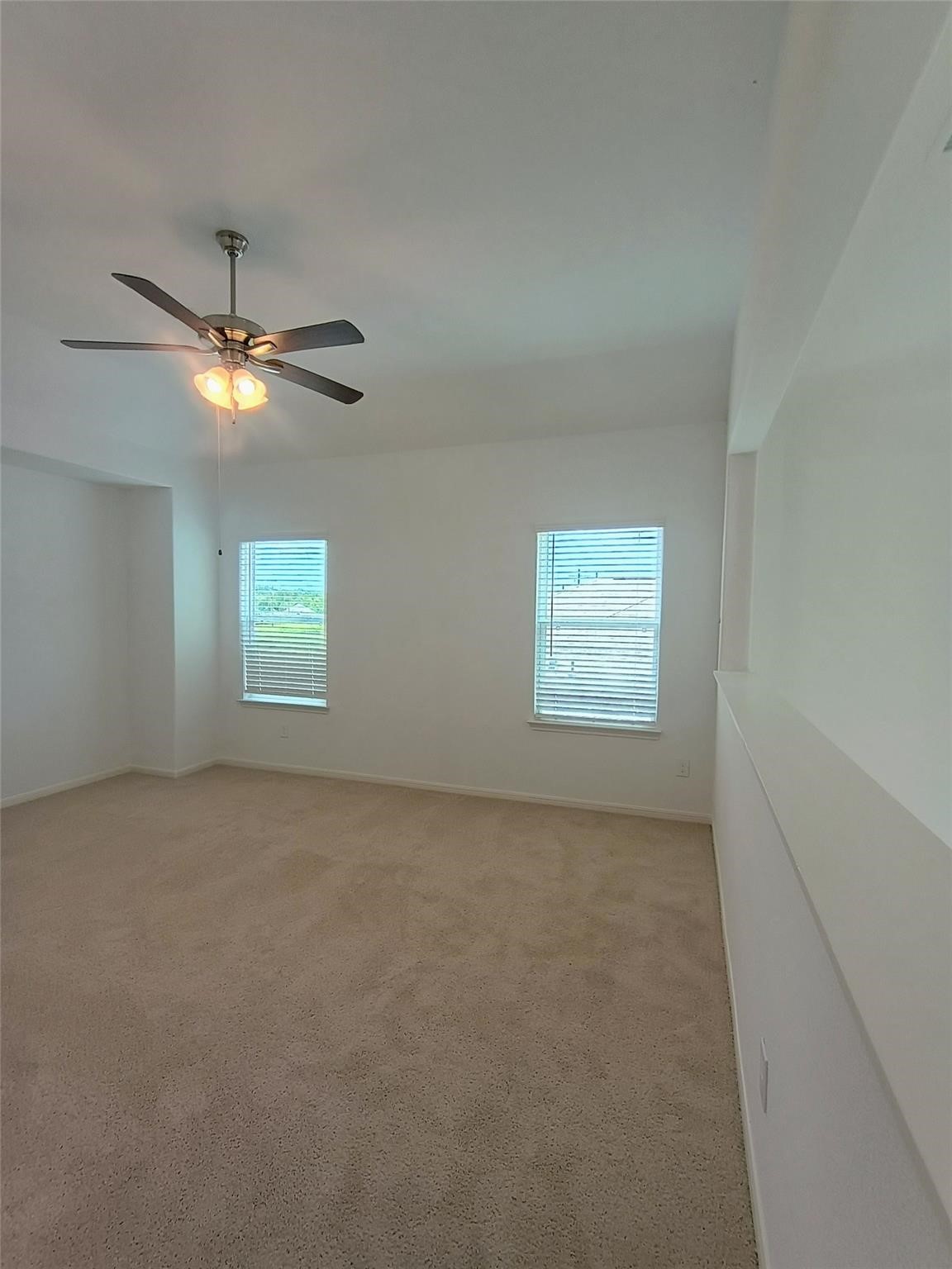 15924 Cy Young Court Splendora, TX 77372 - Photo 18 of 29 an empty room with windows and fan