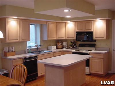 3497 Gun Club Road Nazareth, PA 18064 - Photo 6 of 17 a kitchen that has a sink and a stove in it