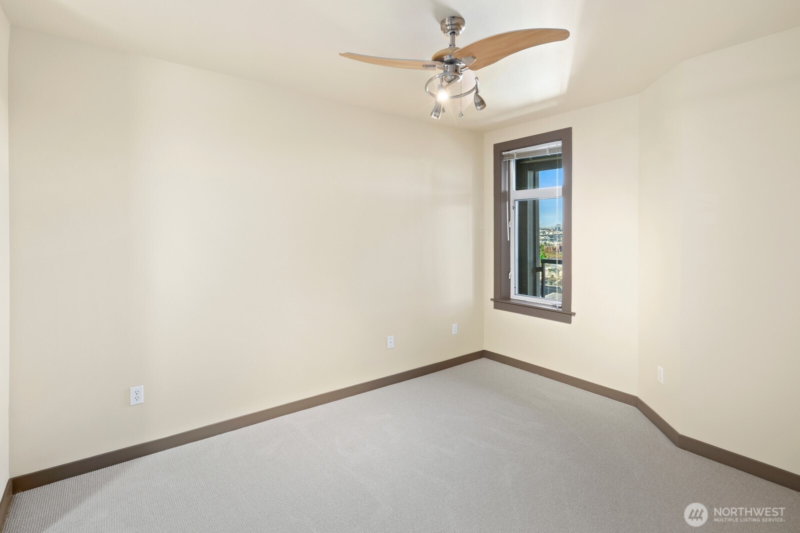 655 Crockett Street, Unit A305 Seattle, WA 98109 - Photo 13 of 23 an empty room with a window and a fan