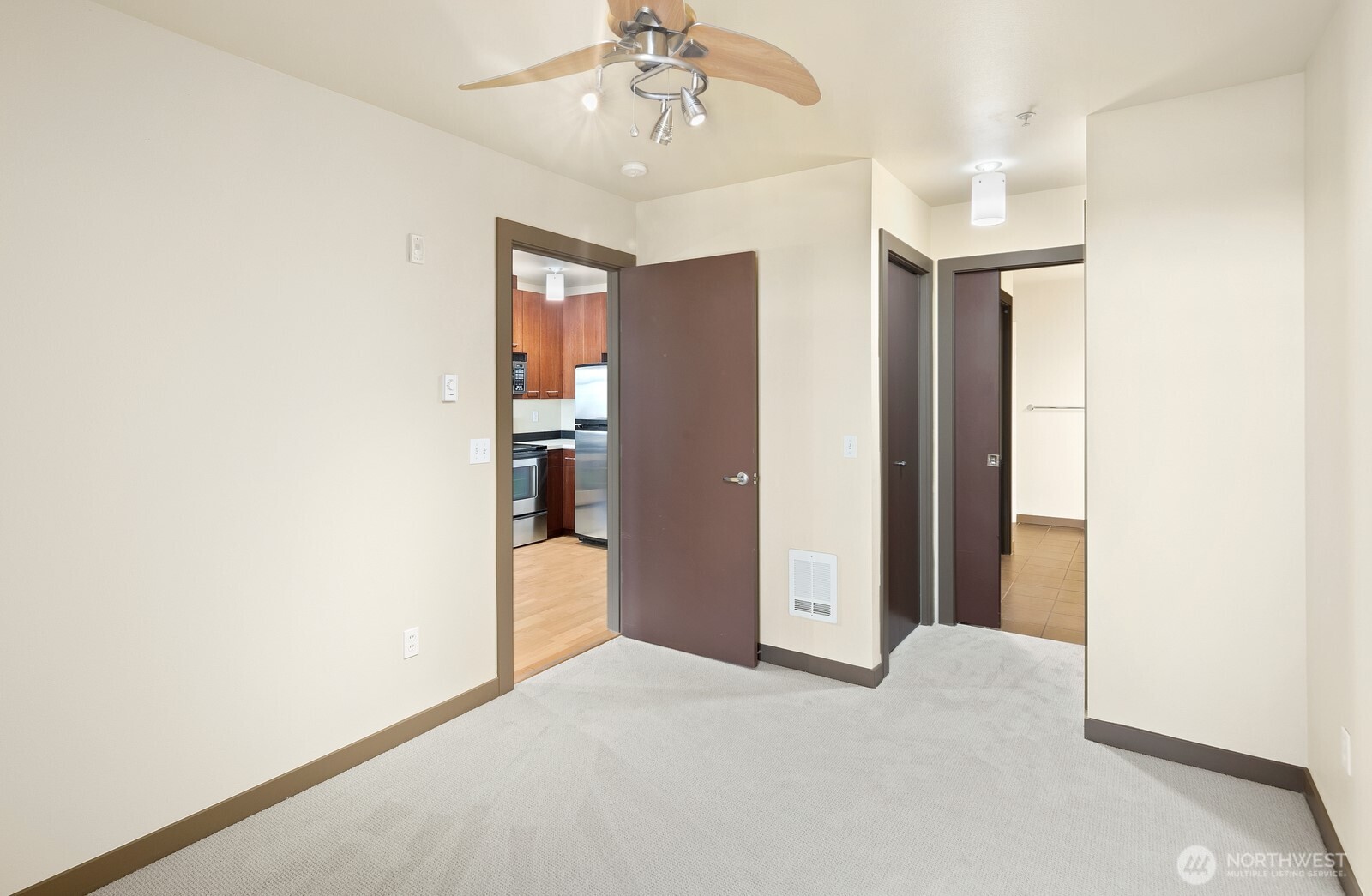 655 Crockett Street, Unit A305 Seattle, WA 98109 - Photo 15 of 23 en empty room with kitchen and window