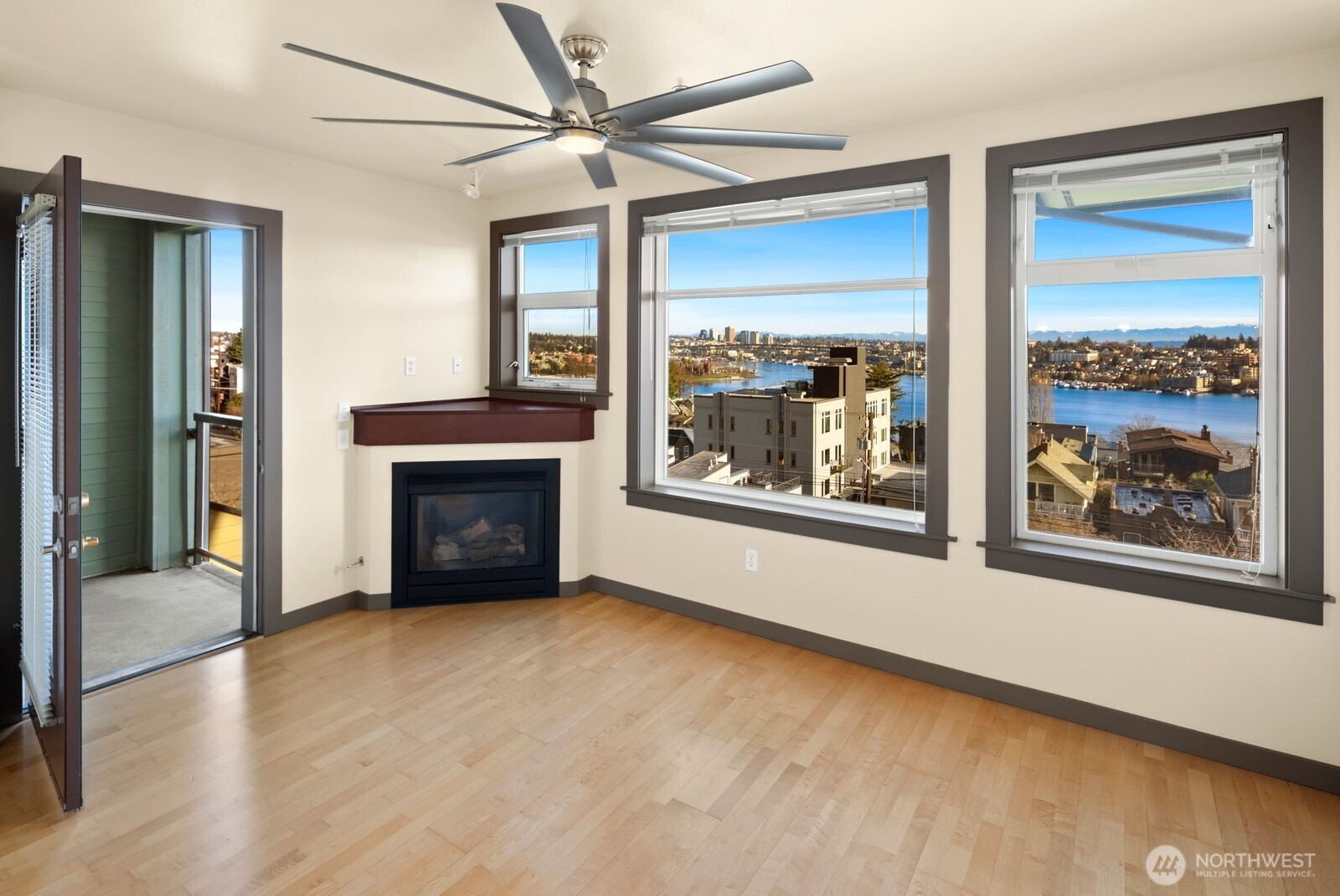 655 Crockett Street, Unit A305 Seattle, WA 98109 - Photo 9 of 23 a view of an empty room with a fireplace and a window