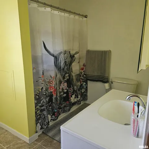 a bathroom with a bathtub and shower