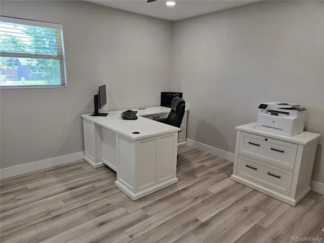 a bathroom with a granite countertop sink and mirror