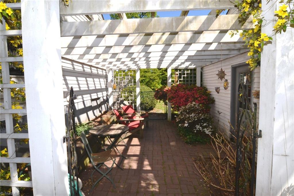4237 Wayne Road Greensboro, NC 27407 - Photo 2 of 21 Breezeway from Garage to House