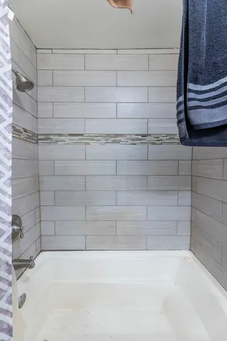 a bathroom with a bathtub