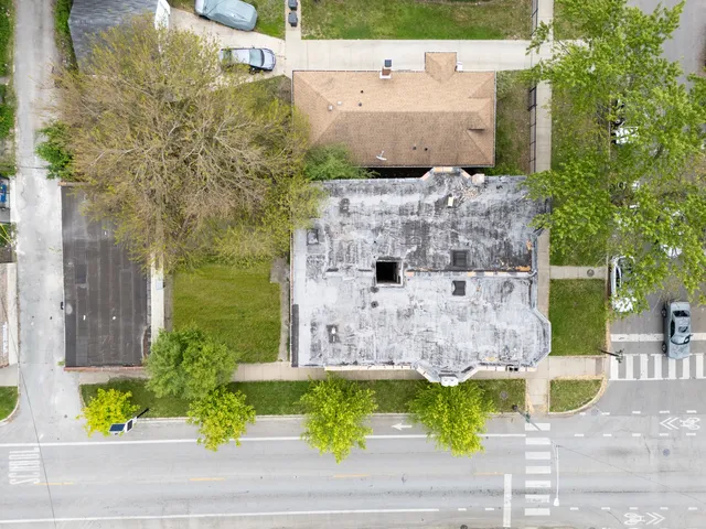 a aerial view of a house with a yard