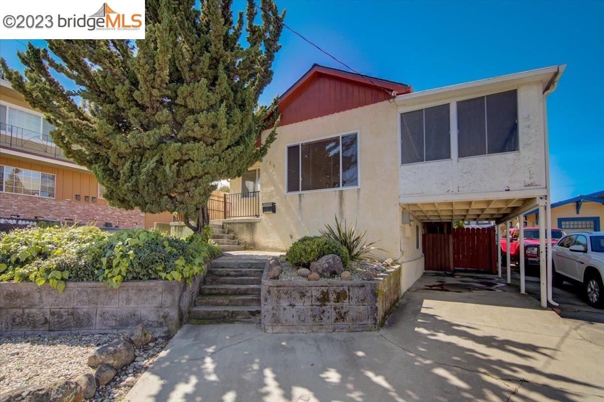 126 Pacific Avenue Rodeo, CA 94572 - Photo 1 of 1 a view of a house with a yard