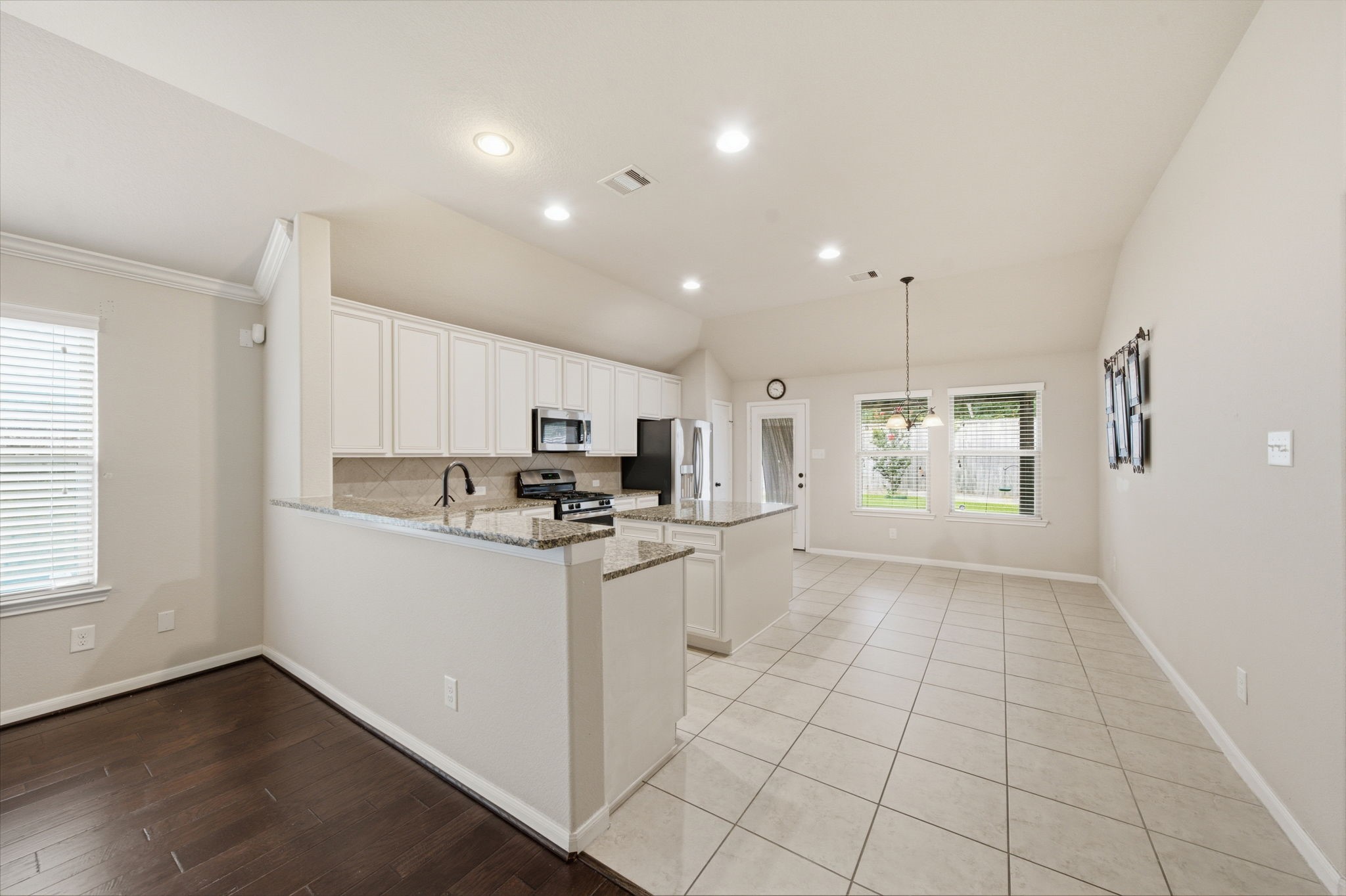7611 Willow School Drive Spring, TX 77389 - Photo 8 of 23 a kitchen with stainless steel appliances a refrigerator sink and microwave