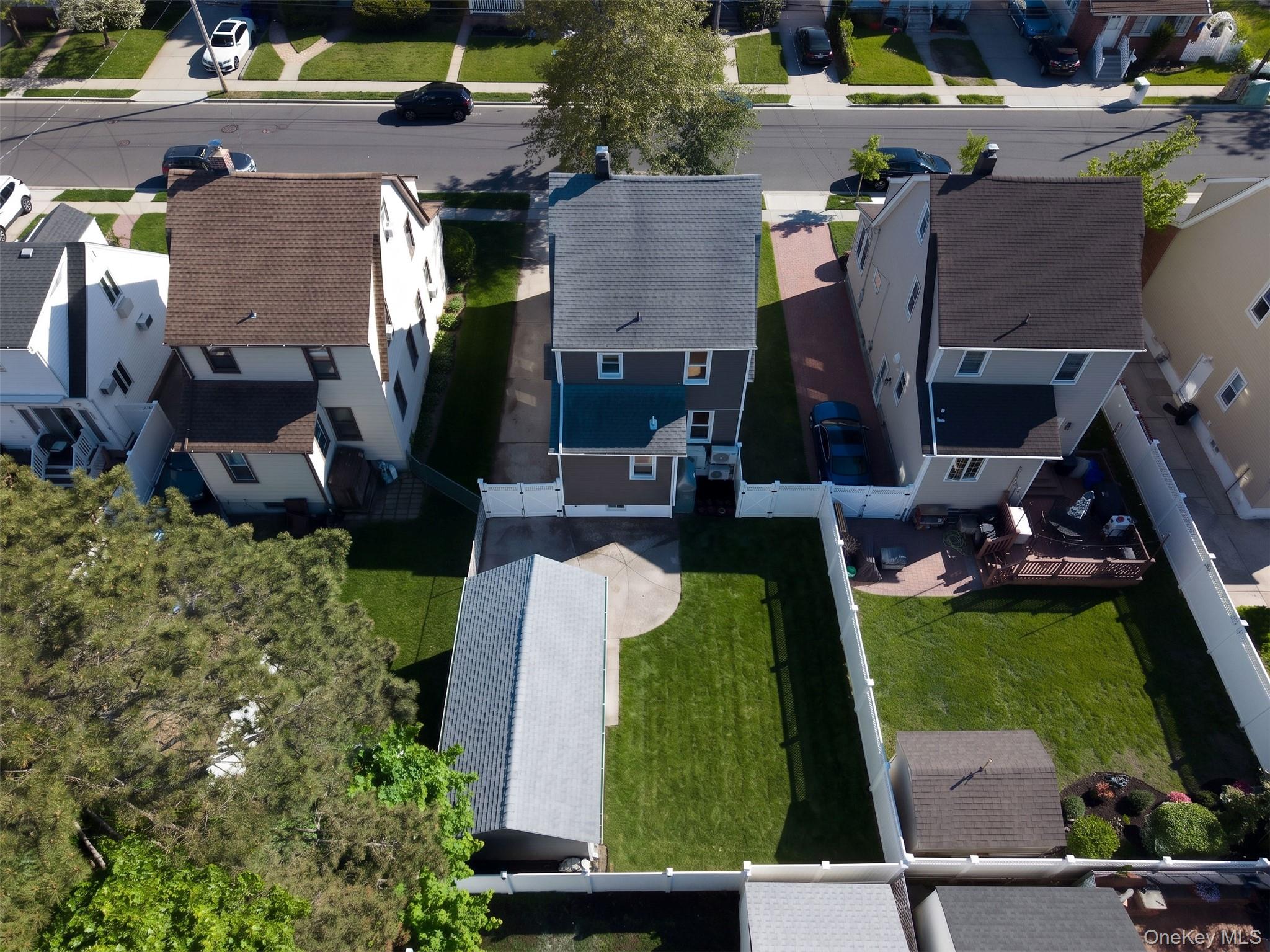 123 East Maple Street Valley Stream, NY 11580 - Photo 8 of 11 an aerial view of a house with a yard basket ball court and outdoor seating
