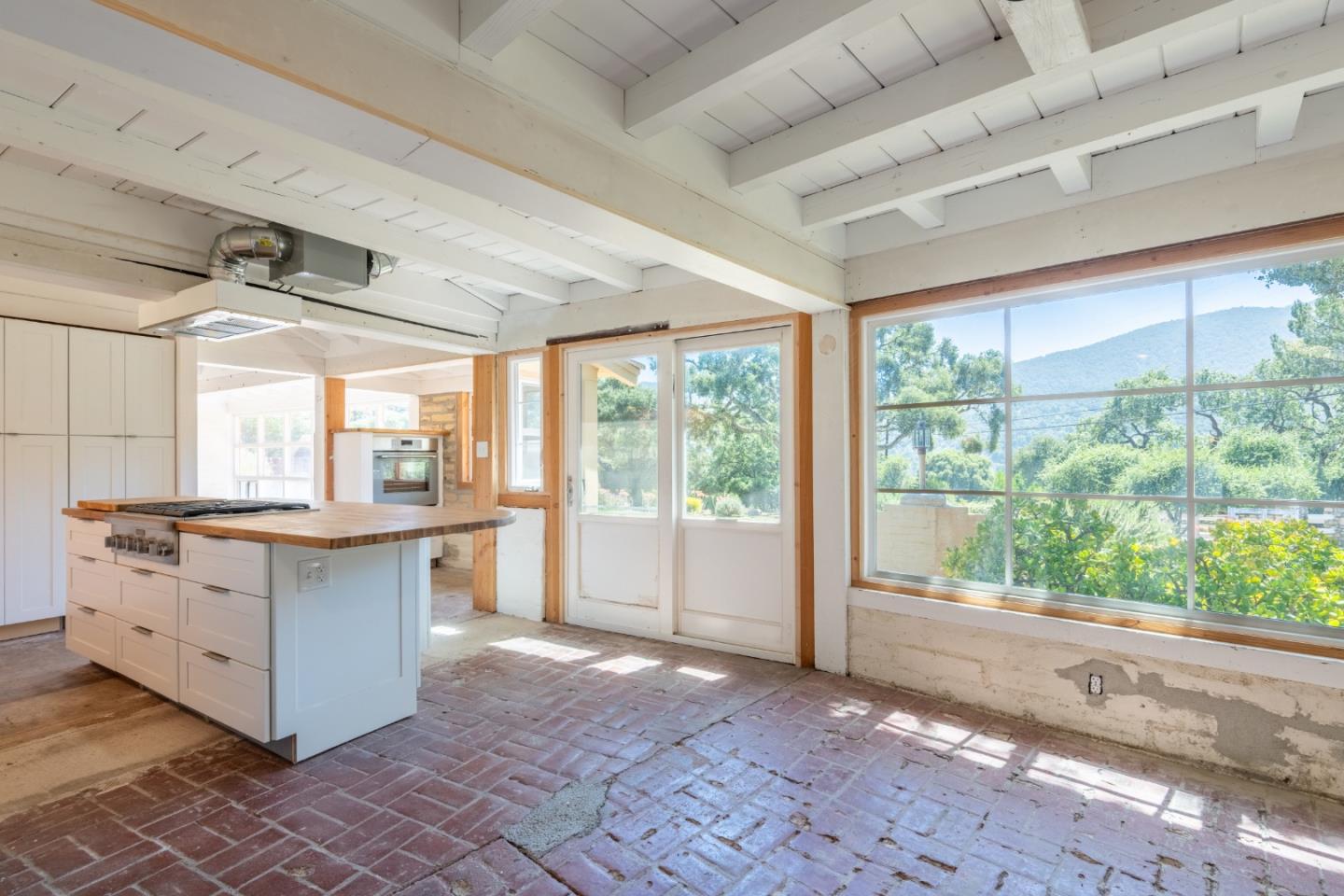 72 Los Laureles Grade Road Carmel Valley, CA 93924 - Photo 12 of 43 a kitchen with a stove and a white cabinets