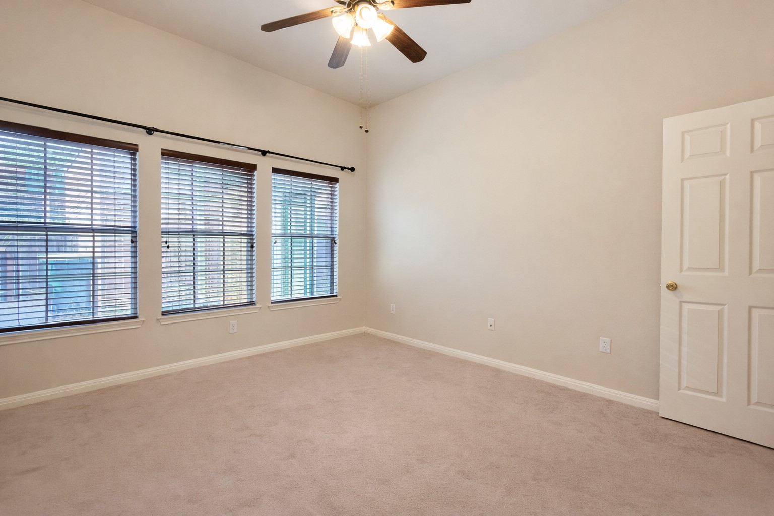 5515 Davis Lane, Unit 82 Austin, TX 78749 - Photo 11 of 20 an empty room with chandelier fan