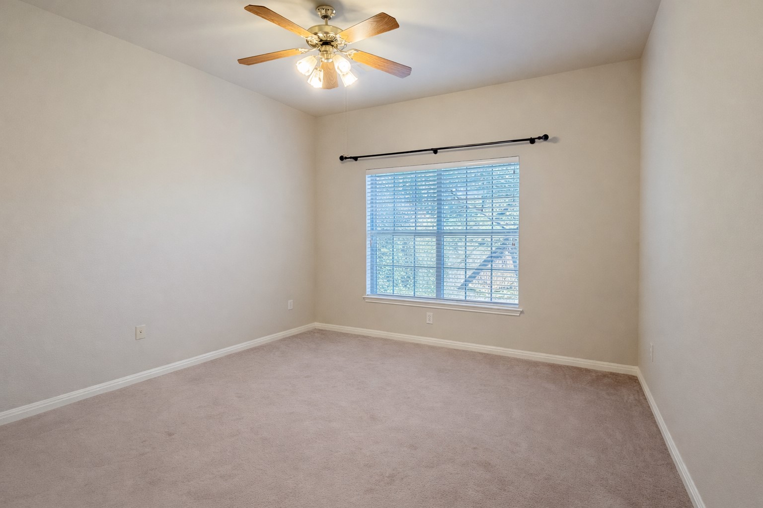 5515 Davis Lane, Unit 82 Austin, TX 78749 - Photo 15 of 20 an empty room with a window and a fan